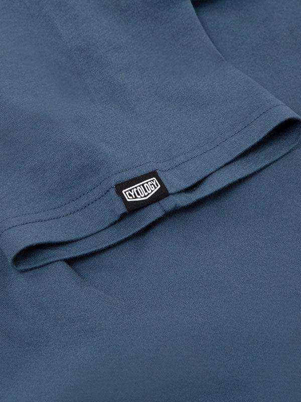 Cycology brand tag on blue cycling apparel, showcasing quality fabric and design detail