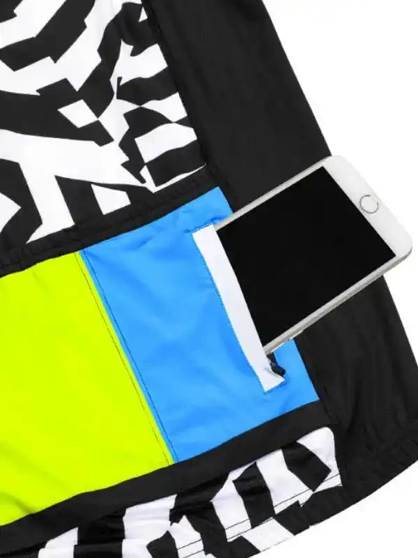 Men's cycling shorts with bold black-white pattern, neon yellow and blue panels, and phone pocket