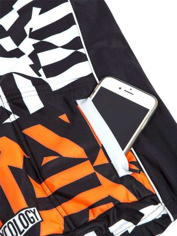 Men's cycling shorts with bold black, white, and orange graphic design and phone pocket