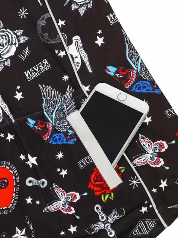 Black cycling shorts with colorful tattoo-style graphics, stars, and phone in pocket