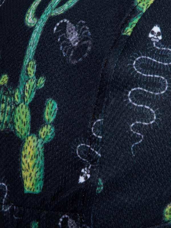 Black cycling jersey with green cactus and white snake print design