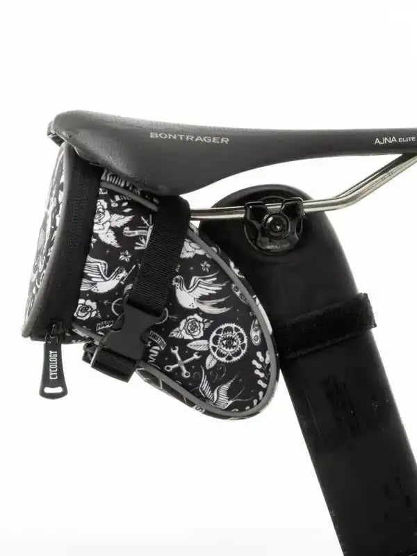 Black and white floral patterned cycling saddle bag attached to Bontrager seat
