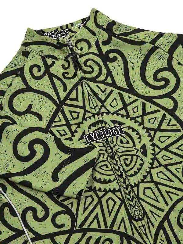 Green cycling jersey with black tribal and gear pattern, featuring 'CYCOLOGY' logo on chest