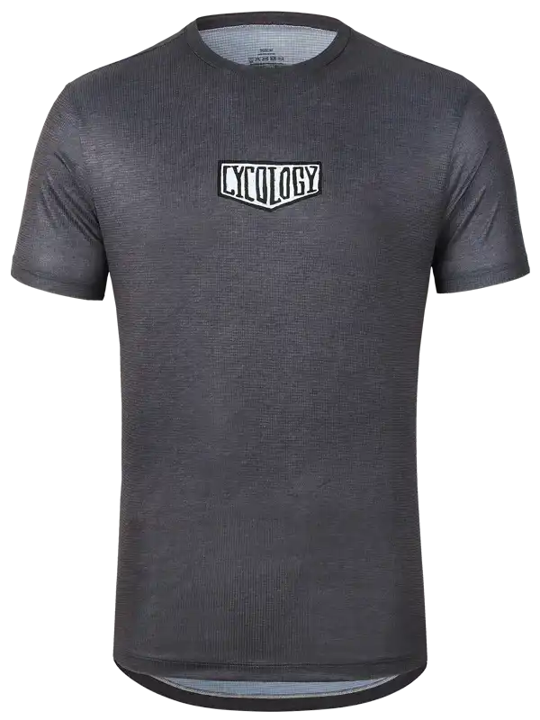 Dark grey men's cycling jersey with white Cycology logo, breathable fabric, ideal for road biking