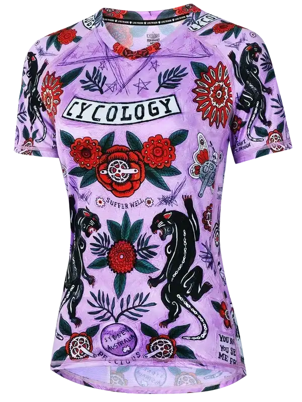 Purple women's cycling jersey with floral and panther tattoo-style print, featuring 'Cycology' branding