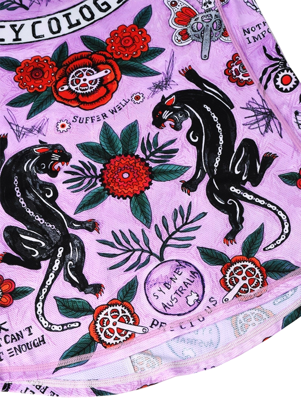Pink fabric with black panther, red flowers, and green leaves 