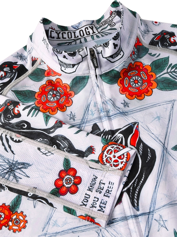 Close up of Long-sleeve cycling jersey with floral and panther design on a grey background