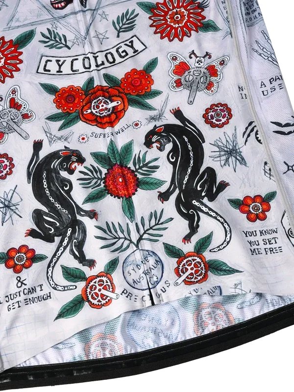 Long-sleeve cycling jersey with floral and panther design on a grey background