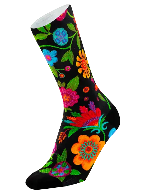 A single crew cycling sock with a black background and a vibrant, multicolored floral pattern, shown against a plain white background.