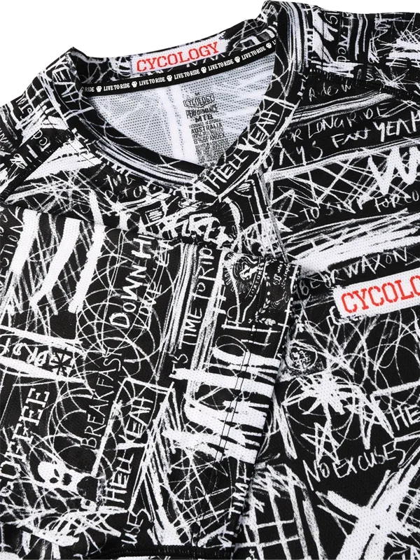 Black and white graffiti-style cycling jersey with bold text graphics and 'CYCOLOGY' branding