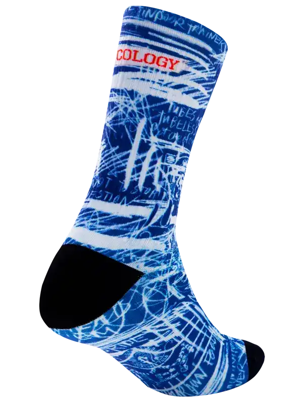 A single crew cycling sock with a blue and white abstract graffiti-style graphic print, featuring the word 'CYCOLOGY' in red text across the upper calf and a solid black toe section, shown on a plain white background.