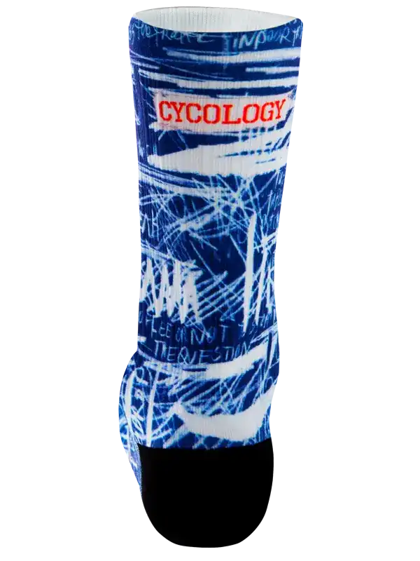 A single crew  cycling sock with a blue and white abstract graffiti-style graphic print, featuring the word 'CYCOLOGY' in red text across the upper calf and a solid black toe section, shown on a plain white background.