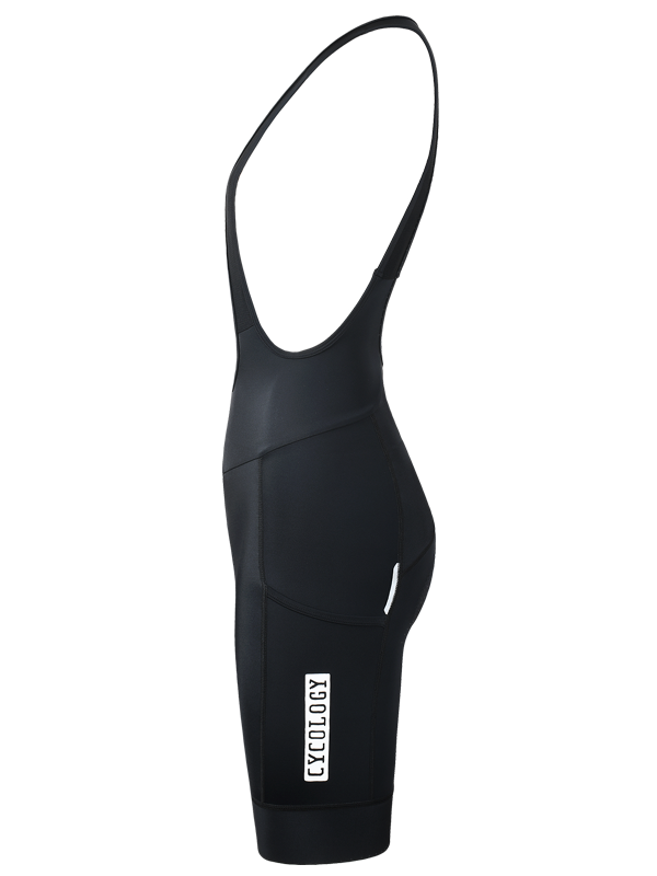 Black quick pee women's cycling bib shorts with integrated shoulder straps, shown from the back on a plain white background. A small white vertical brand logo is visible on the lower right leg cargo pocket