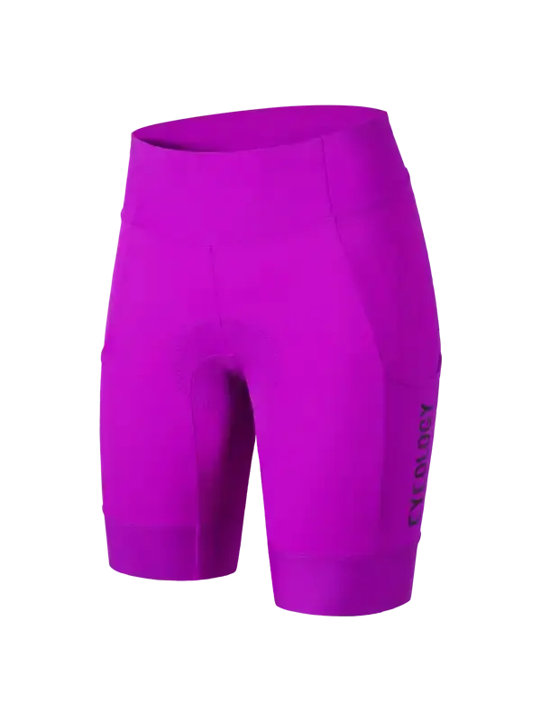 Bright magenta women's cycling shorts with a high waist and a vertical black 'CYCOLOGY' logo on the lower left leg cargo pocket,