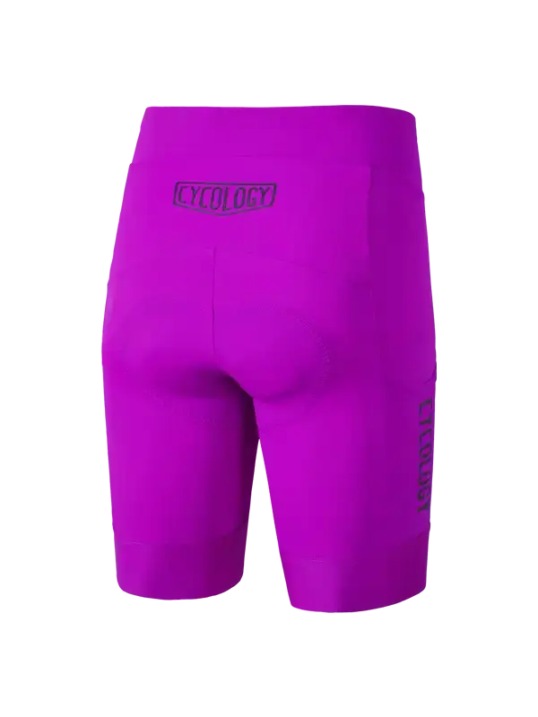 Bright purple cycling shorts with a dark purple 'CYCOLOGY' logo on the back waistband and vertical 'CYCOLOGY' branding on the left leg, cargo pocket  shown against a plain white background.
