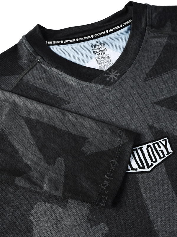 Black and gray long-sleeve MTB cycling jersey with Large white arrow graphic on the back 