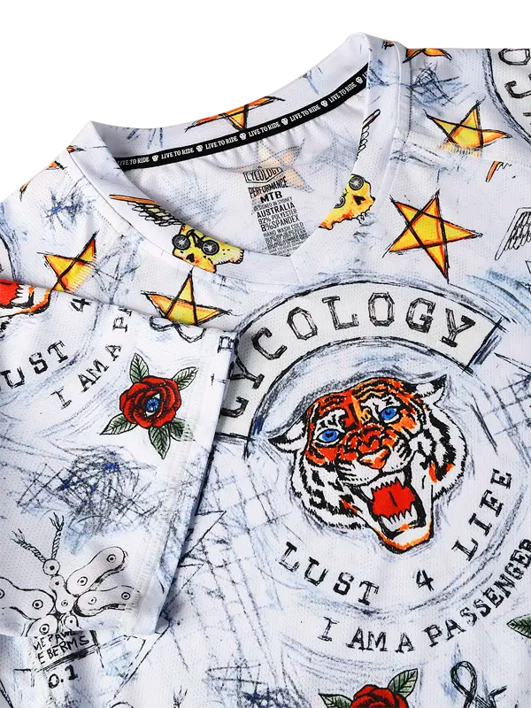 City of Angels White Women's Short Sleeve MTB Jersey Cycology with colorful graphics and text including a tiger design and various symbols.