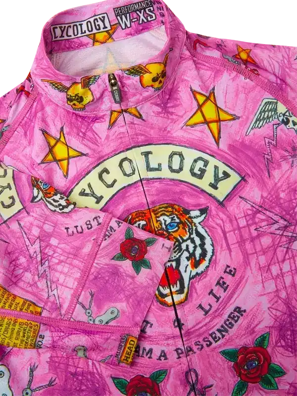 Pink women's cycling jersey with tiger, roses, stars, and tattoo-style graphics, size W-XS