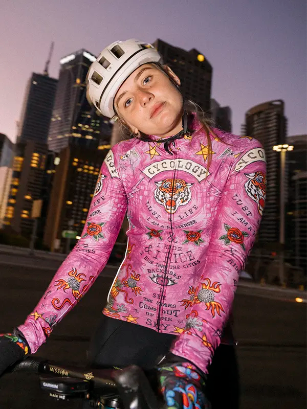 Pink long sleeve cycling jersey with a tiger and graphic designs