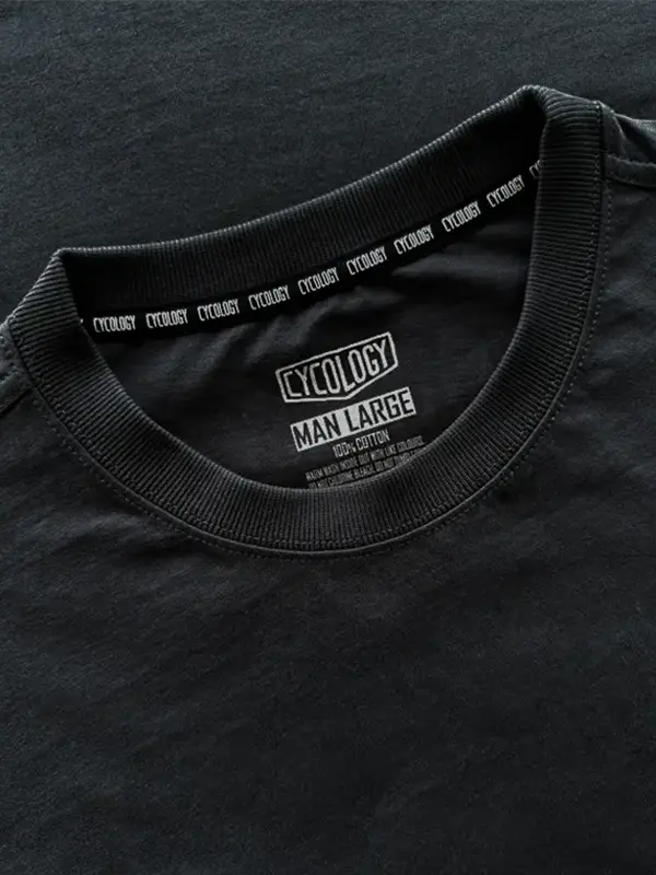Black t-shirt with Cycology branding on the collar and label.