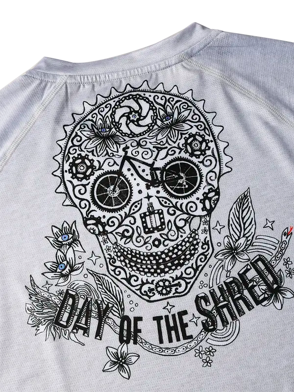Grey MTB Jersey with a black skull design and 'Day of the Shred' text on a light background