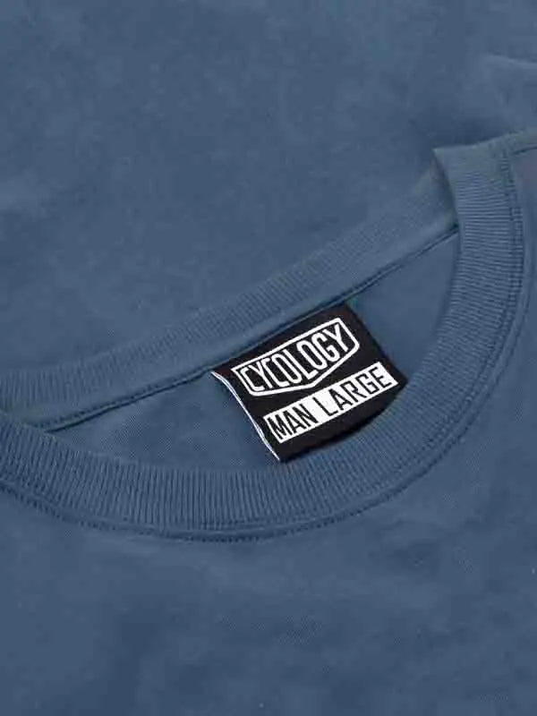 Blue t-shirt with a label on the collar