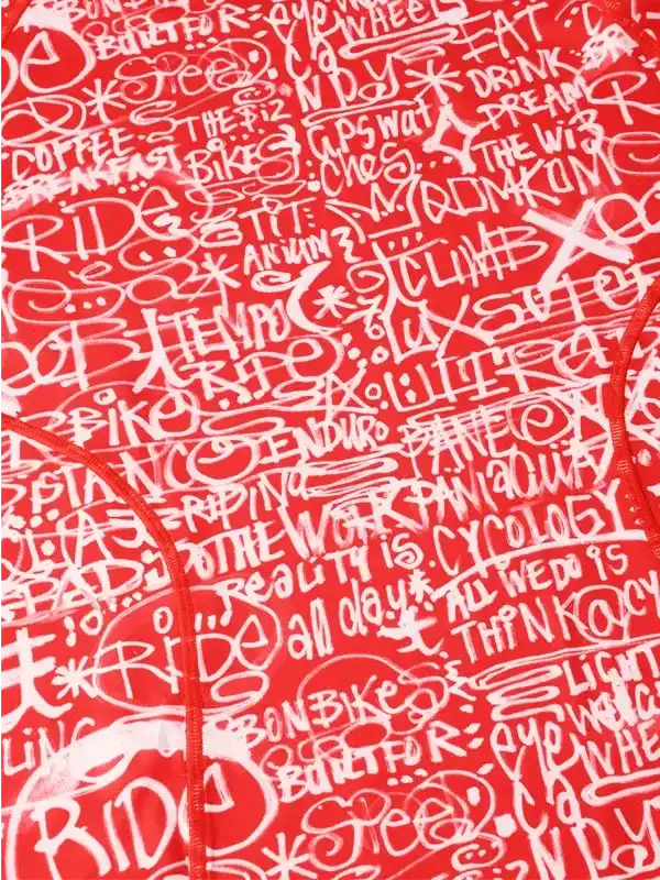 Red cycling jersey with white graffiti-style cycling phrases and slogans, ideal for men and women riders.