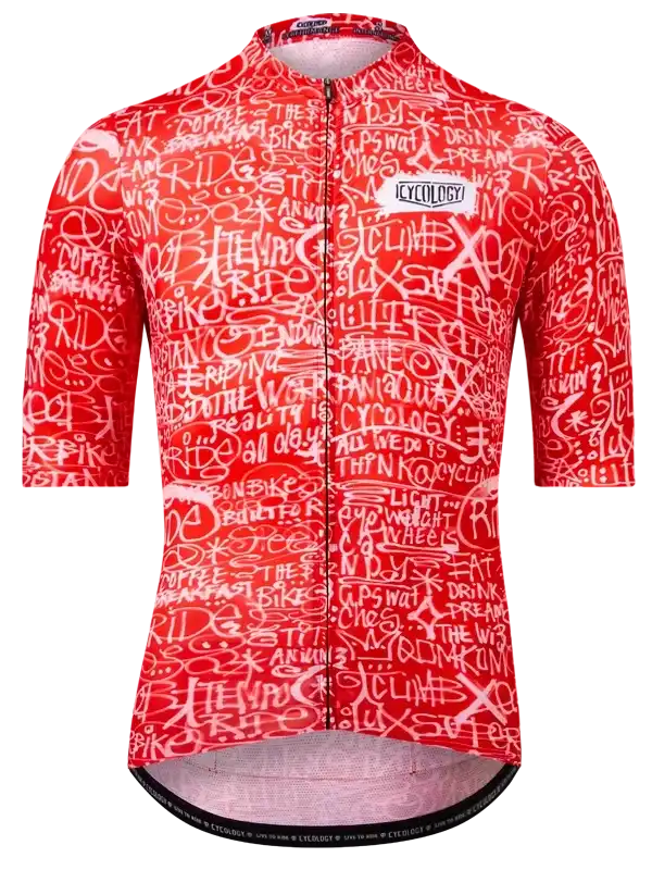 Red women's cycling jersey with white graffiti-style text, featuring 'RIDE' and 'CLIMB' phrases, ideal for road biking.