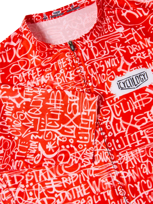 Red cycling jersey with white text pattern