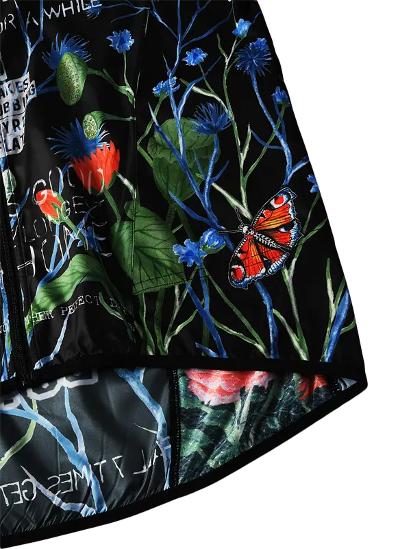 Close-up of a floral design with butterflies on a black background