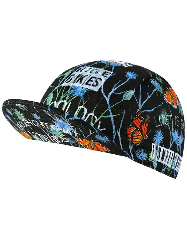 Black cycling cap with butterfly and floral print, featuring 'RIDE BIKES' text for men's and women's bike wear