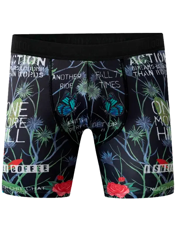 Men's cycling shorts with butterfly, rose, and motivational text print on black fabric