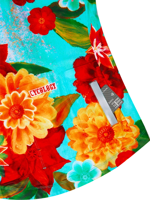 Colorful floral-patterned cycling jersey with 'Cycology' branding on a aqua background