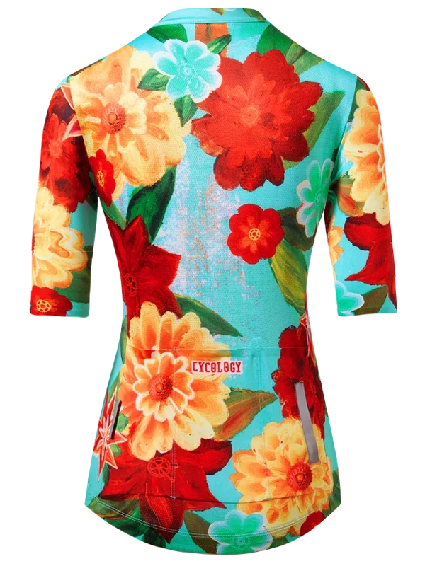 Colorful floral-patterned cycling jersey with 'Cycology' branding on a aqua background