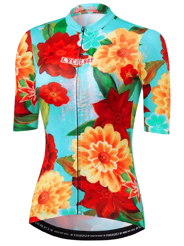 Colorful floral-patterned cycling jersey with 'Cycology' branding on a aqua background