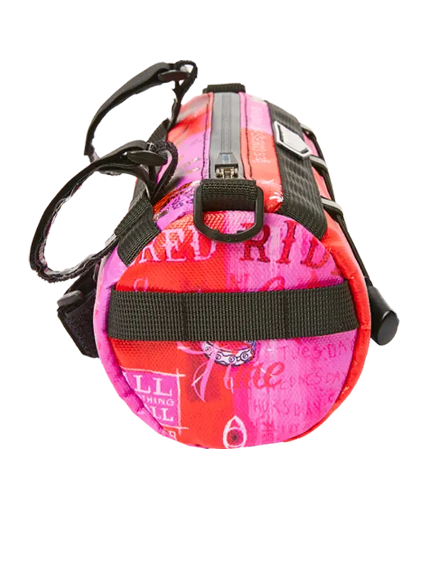 Pink and red bike bag with black straps 