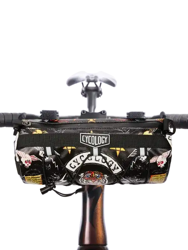 Cycology bike handlebar bag with skull and tiger print, mounted on bicycle handlebars