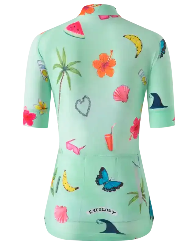 Women's tropical print cycling jersey with palm trees, flowers, and fruit on mint green fabric