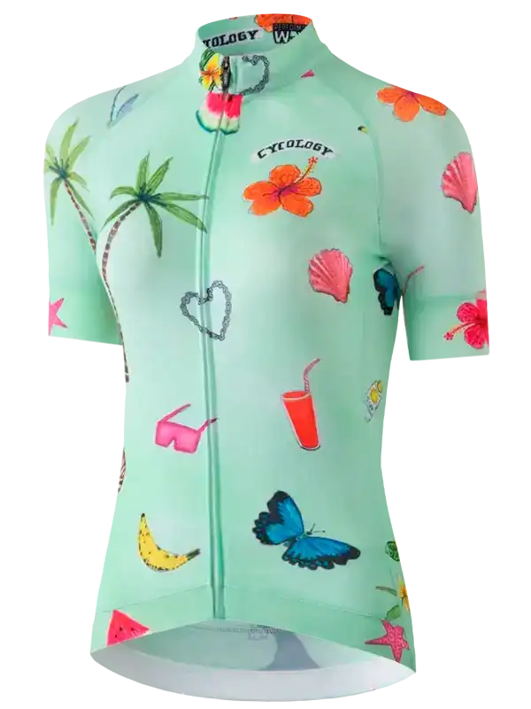 Women's tropical print cycling jersey with palm trees, hibiscus, and seashells on mint green fabric
