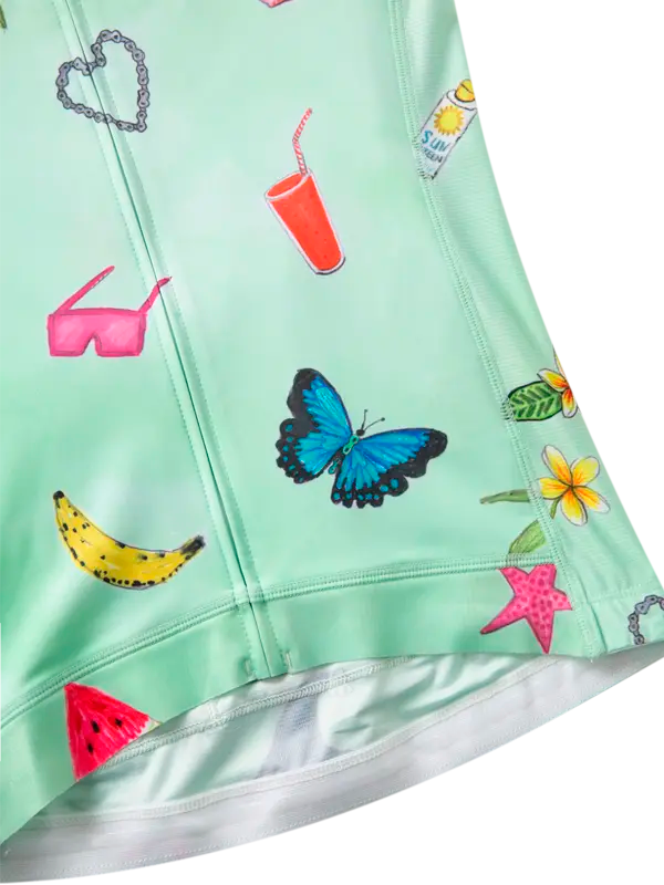 Light green fabric with colorful prints including a butterfly, banana, and watermelon 