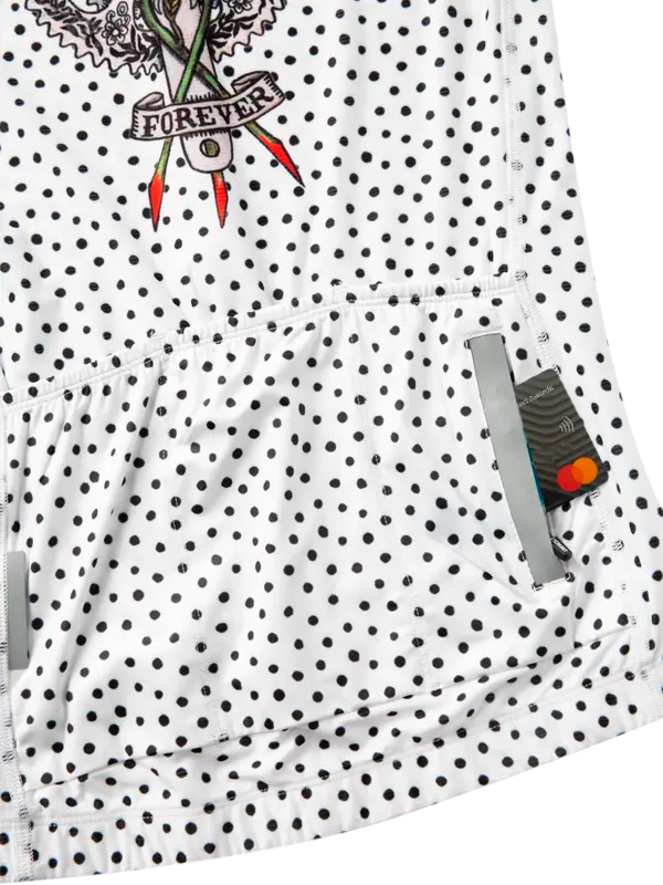 White cycling jersey with black polka dots and a tattoo-style graphic on a white background- zip pocket