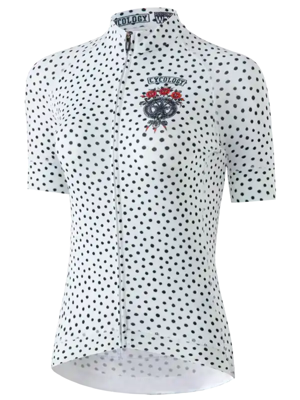 White women's cycling jersey with black polka dots and skull graphic, featuring full zip and brand logo