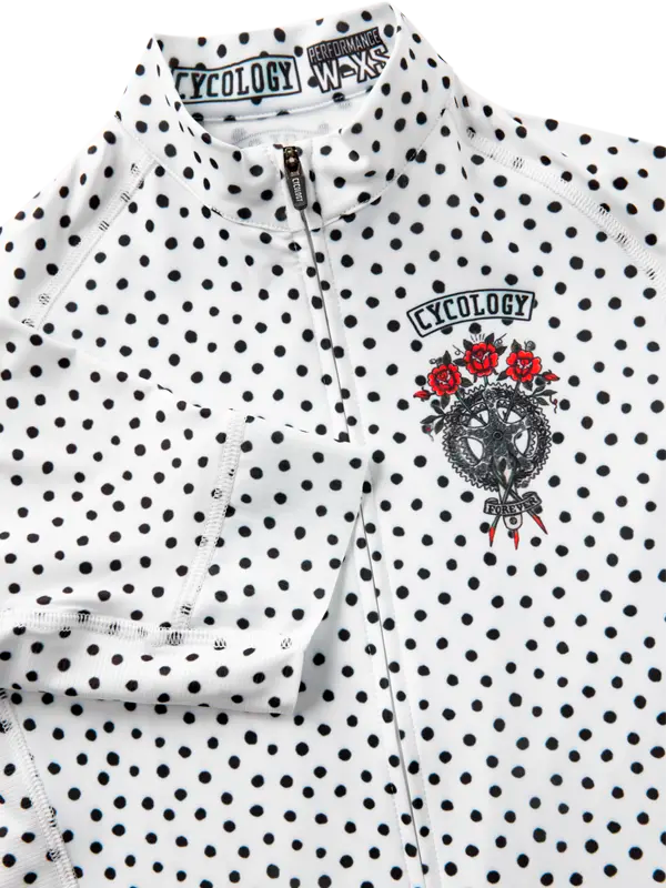 White polka dot cycling jersey with black text and logo on a white background