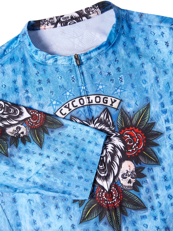 Cycling jersey with floral and skull design on a blue background, featuring the brand 'Cycology'.