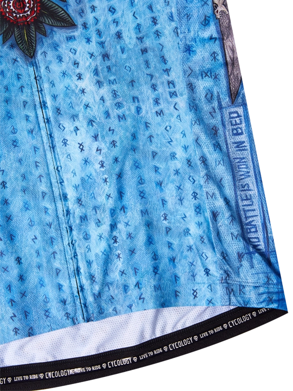 Blue fabric with floral patterns and text 