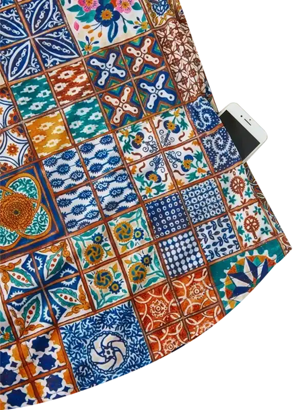 Colorful patchwork cycling jersey with phone pocket, vibrant tile patterns for women's bike wear