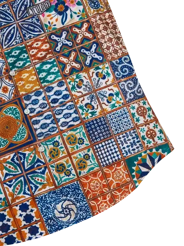 Colorful patchwork cycling shirt with tile-inspired patterns and button details