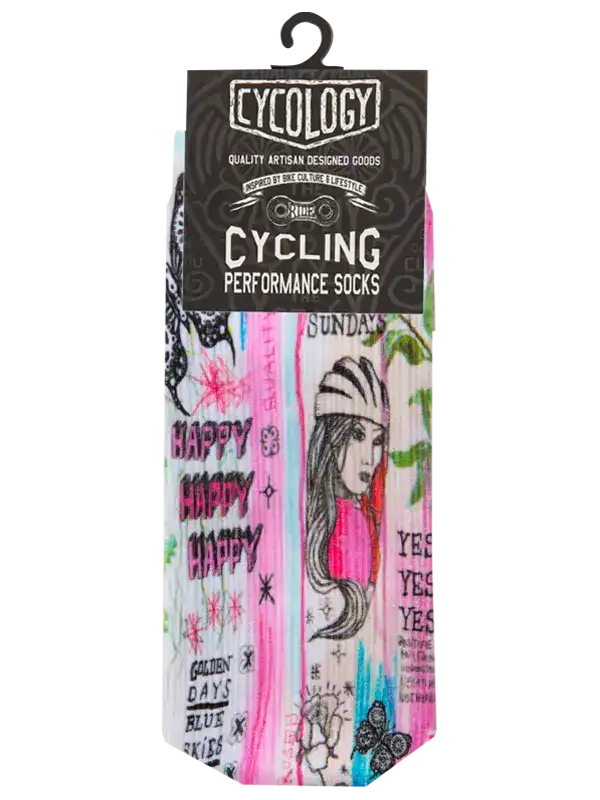 A pair of multicolor graphic cycling socks in retail packaging with a black header card. The socks feature a vibrant graffiti-style design with pink, blue, green, and white paint strokes, black text, and a line-art illustration of a woman wearing a cycling helmet.