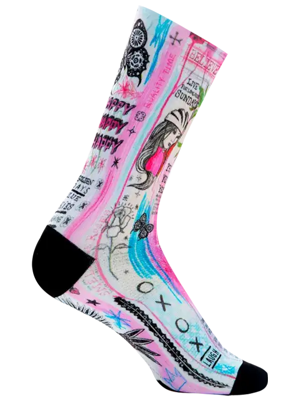 A single crew cycling sock with a vibrant graffiti-style graphic print featuring pink, blue, black, and white elements, including text, doodles, and a stylized illustration, shown on a plain white background.