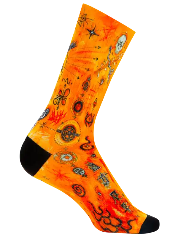 A single crew cycling sock with a vibrant orange and yellow background featuring a detailed  art pattern of snakes, stars, and geometric symbols, finished with solid black toes and heels.